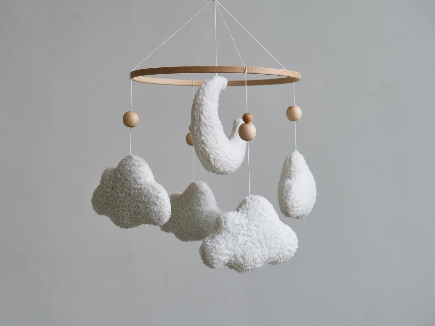 Soft boucle baby mobile with white moon and clouds on natural wooden ring