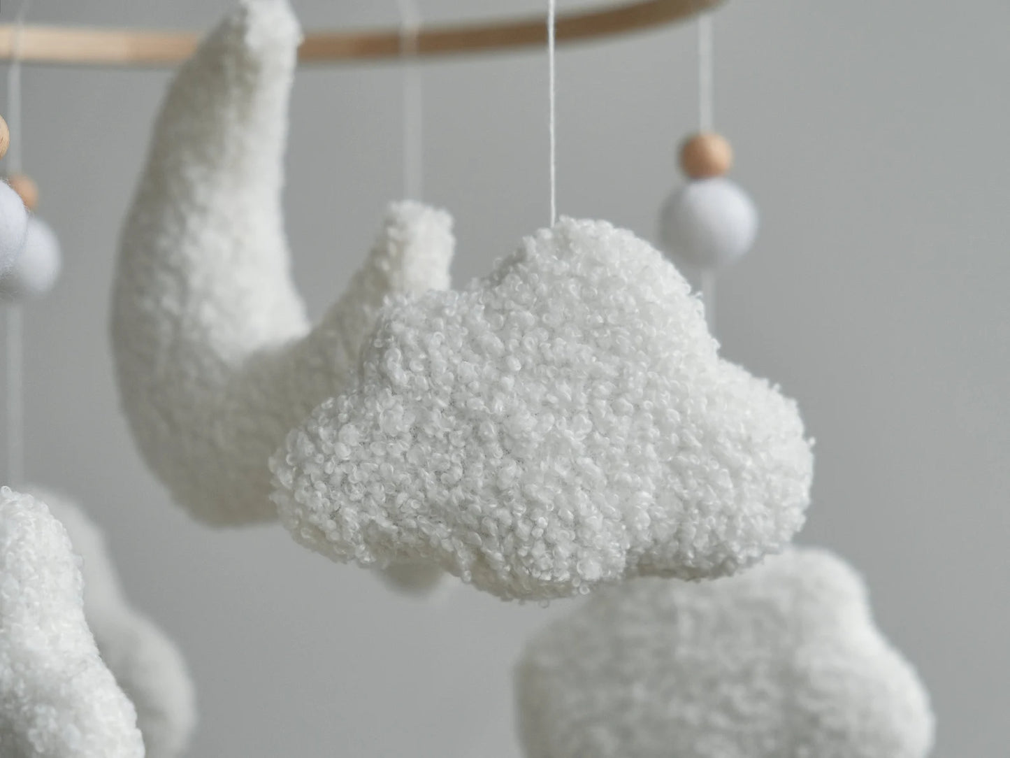 Boucle cloud close-up on soft baby mobile – handmade textured plush cloud nursery mobile detail