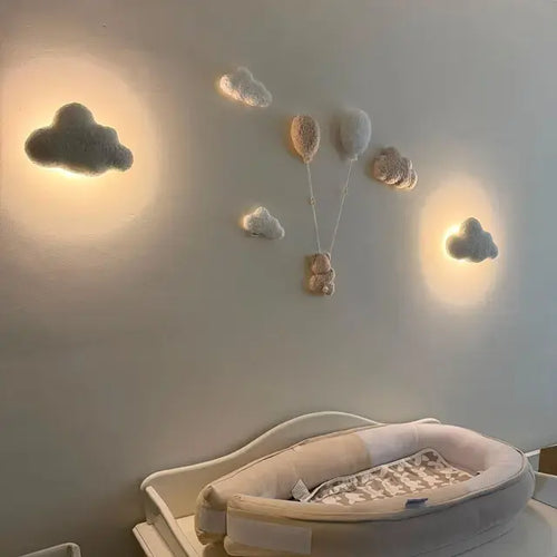 Boucle cloud night light set in real customer nursery – cloud wall lamps glowing above baby nest