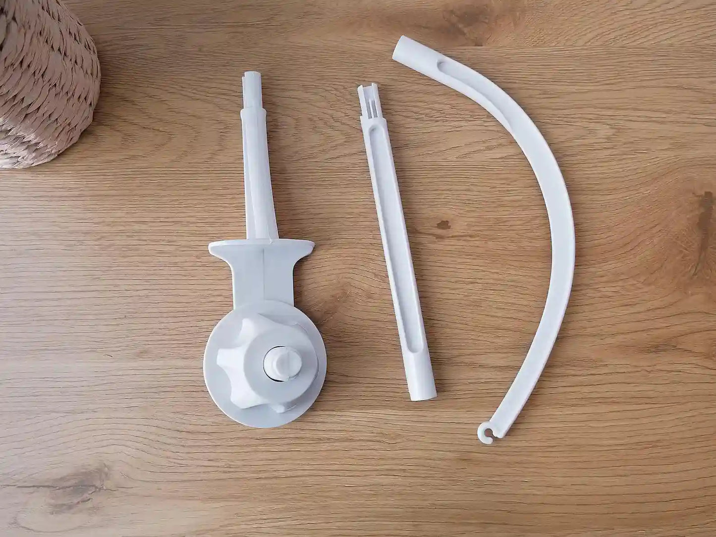 Disassembled crib mobile arm – white plastic holder parts for baby mobile