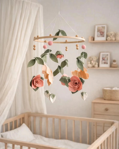 Floral mobile hanging above a crib in a nursery