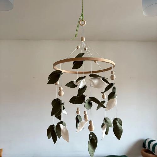 Handmade felt eucalyptus mobile hanging from ceiling – green leaves baby mobile with wooden hoop