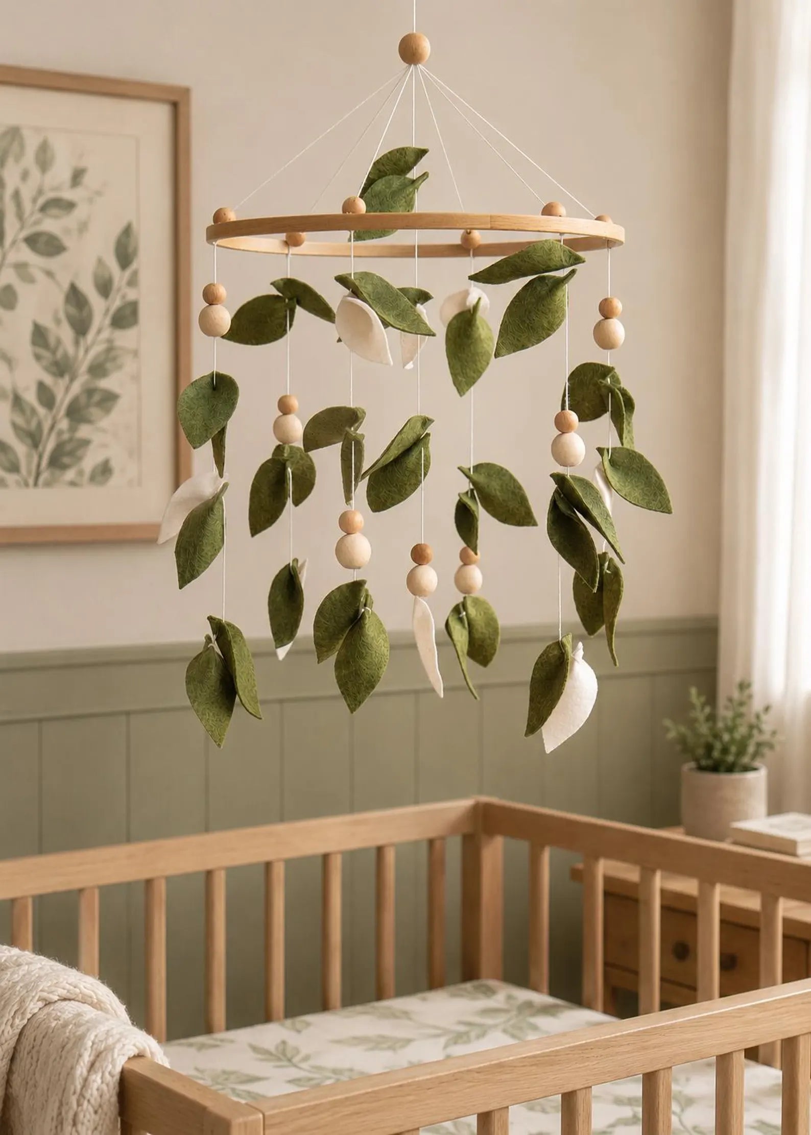 Felt green leaf mobile in sage nursery above crib – botanical baby room decor