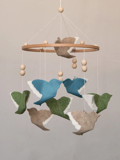 Woodland Mix flying bird mobile with blue, green and beige felt birds on a wooden hoop