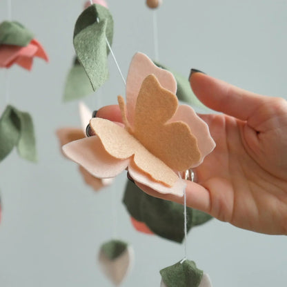 Felt butterfly closeup – handmade floral baby mobile detail in peach and pink