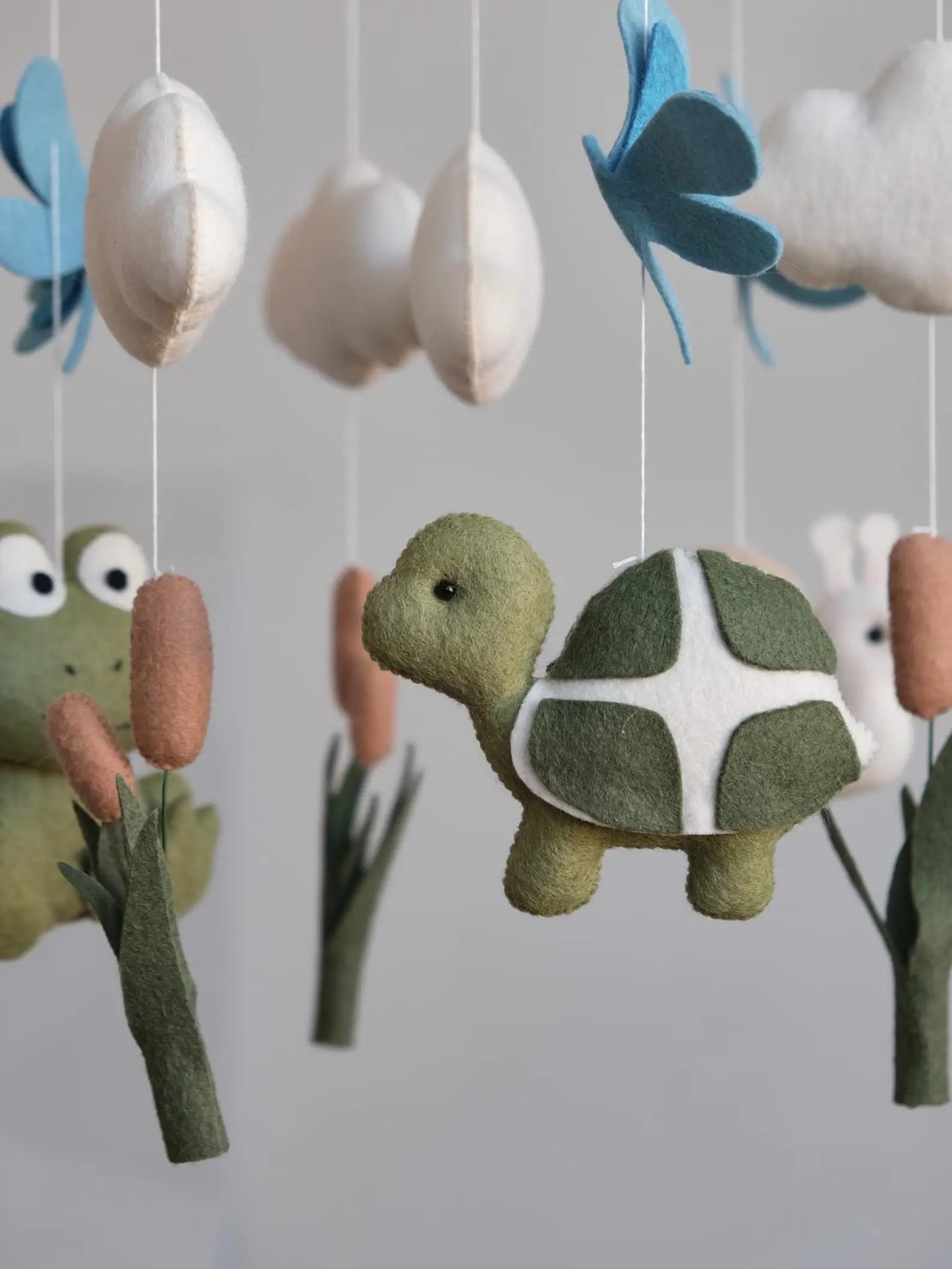 Felt turtle and frog baby mobile closeup – handmade pond animal nursery mobile
