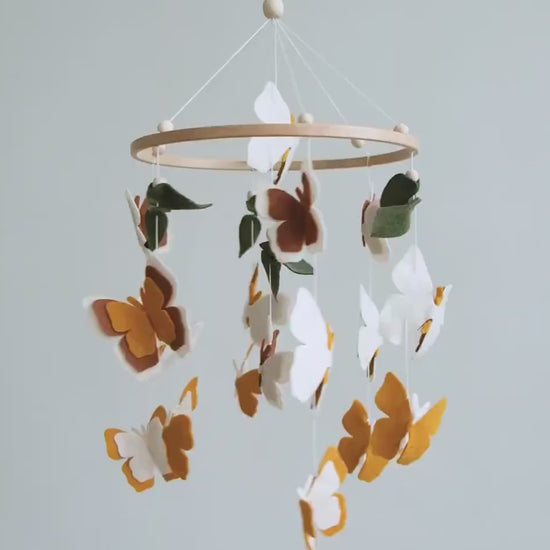 Video of felt baby mobile with neutral butterflies – handmade boho nursery crib mobile