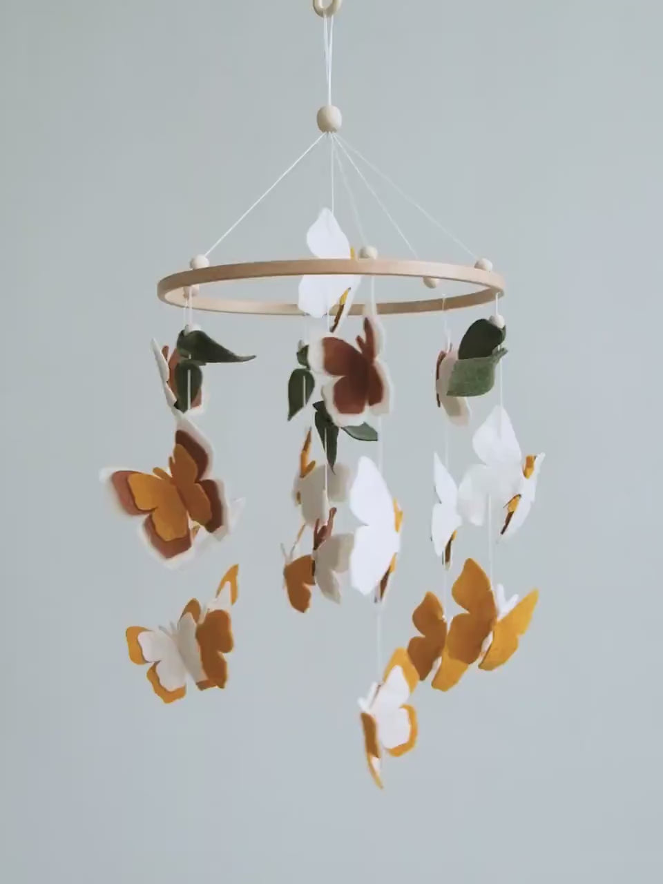 Video of felt baby mobile with neutral butterflies – handmade boho nursery crib mobile