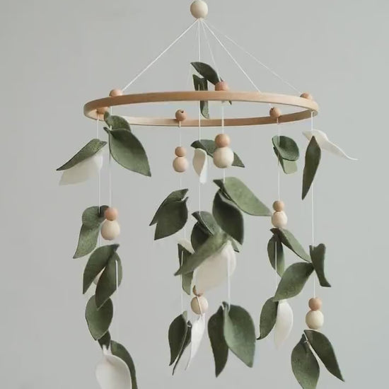 Video of felt baby mobile with green leaves – handmade botanical nursery crib mobile