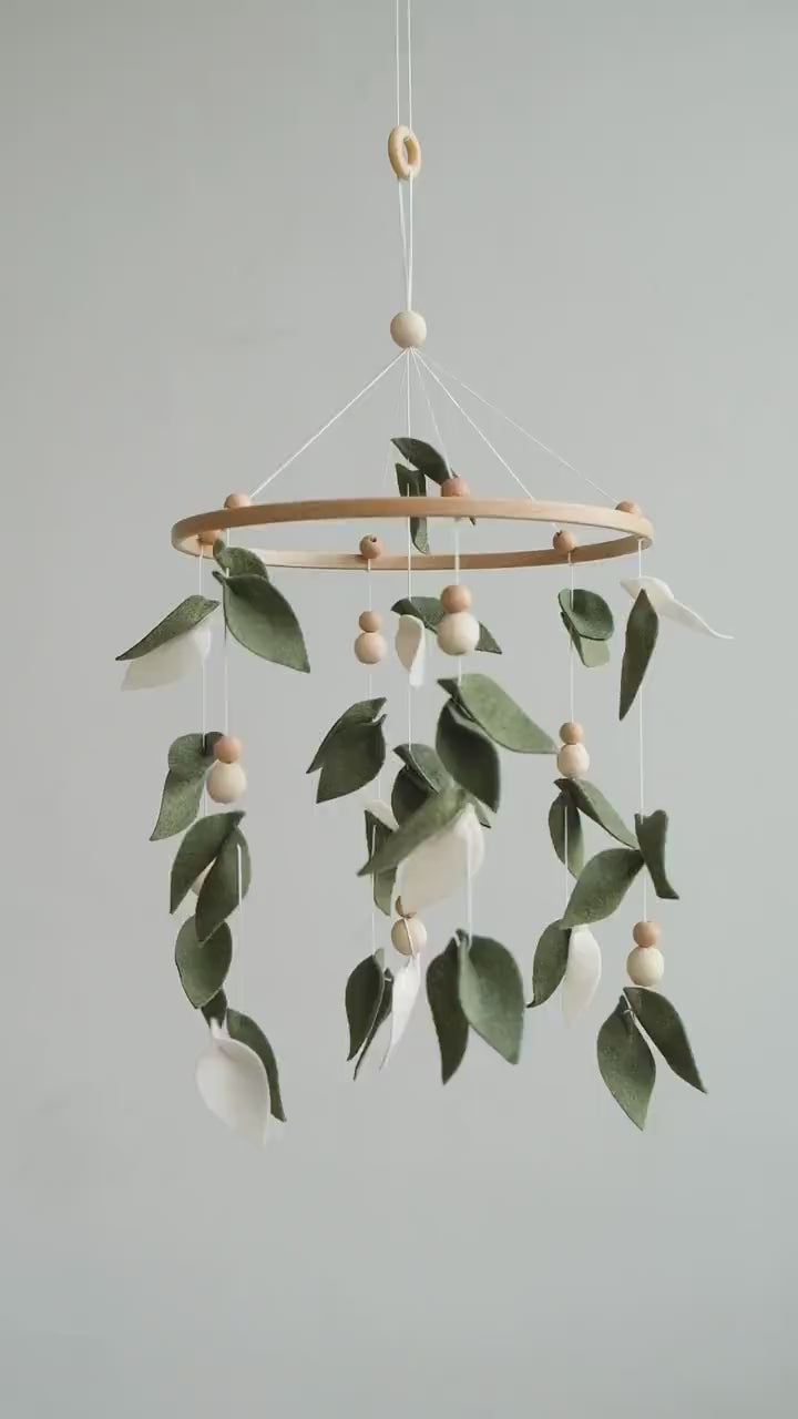 Video of felt baby mobile with green leaves – handmade botanical nursery crib mobile