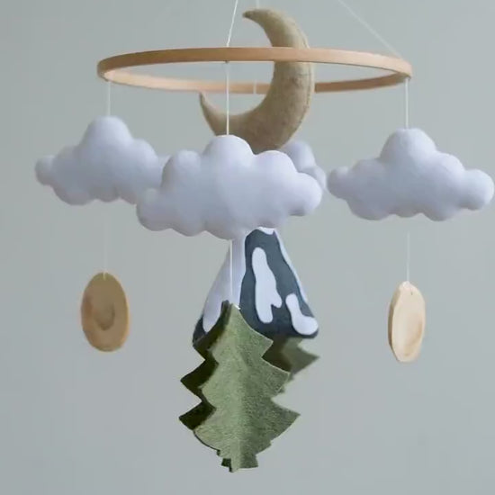 Video of felt baby mobile with mountain, moon and clouds – handmade woodland nursery crib mobile