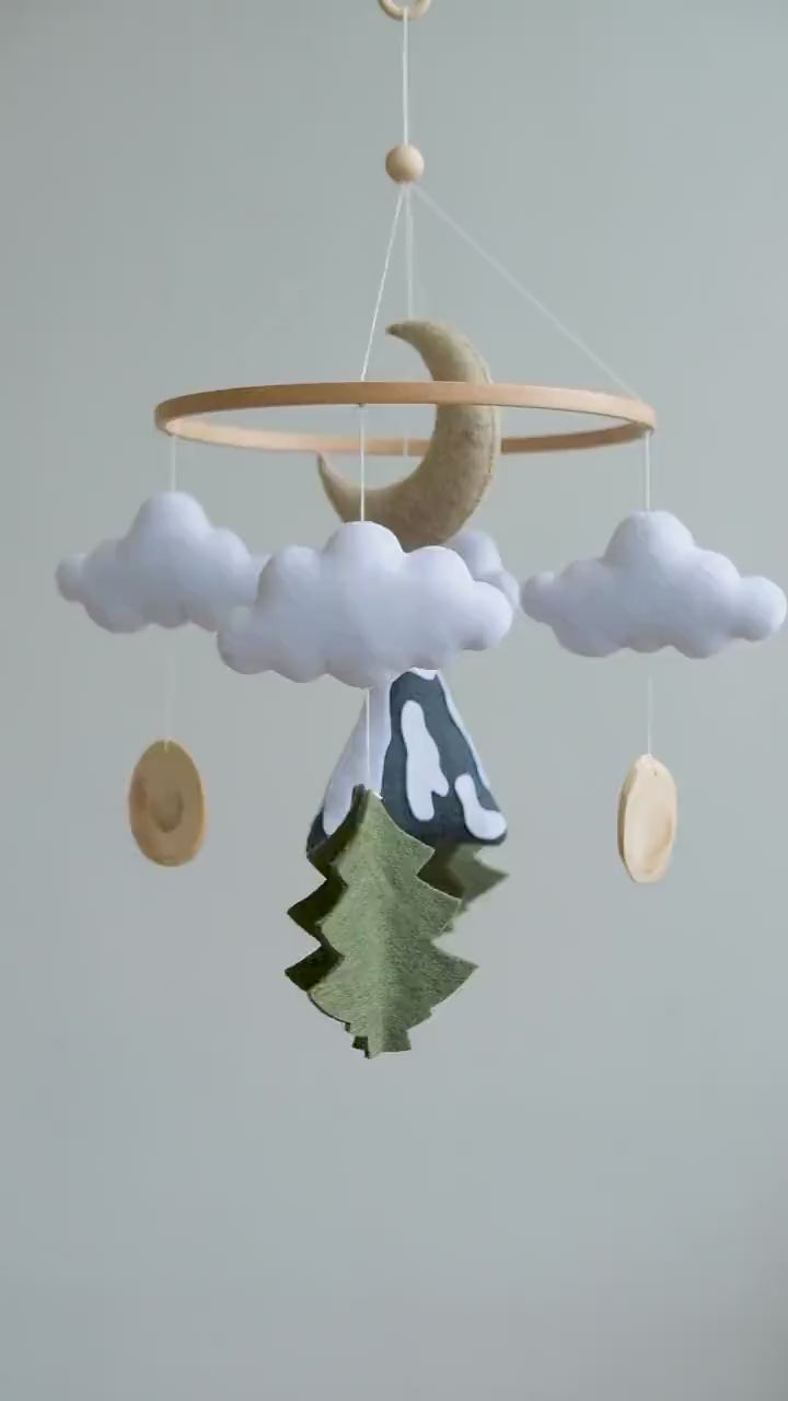 Video of felt baby mobile with mountain, moon and clouds – handmade woodland nursery crib mobile