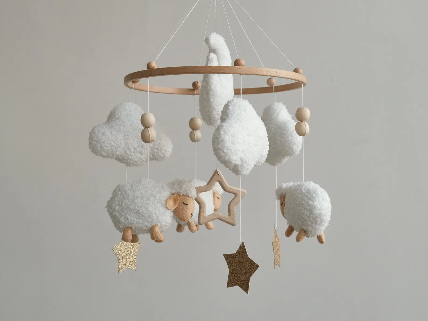 Soft boucle baby mobile with white sheep, clouds and gold glitter stars hanging on wooden ring, nursery decor