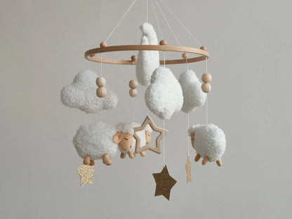 Soft boucle baby mobile with white sheep, clouds and gold glitter stars hanging on wooden ring, nursery decor