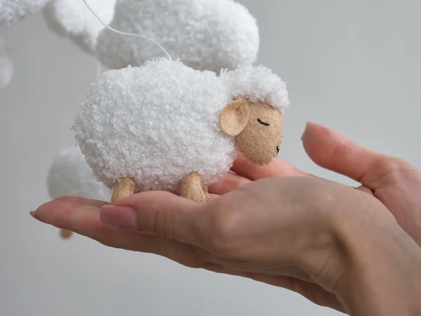 Baby mobile with boucle sheep and cloud accents, soft nursery decor for newborn