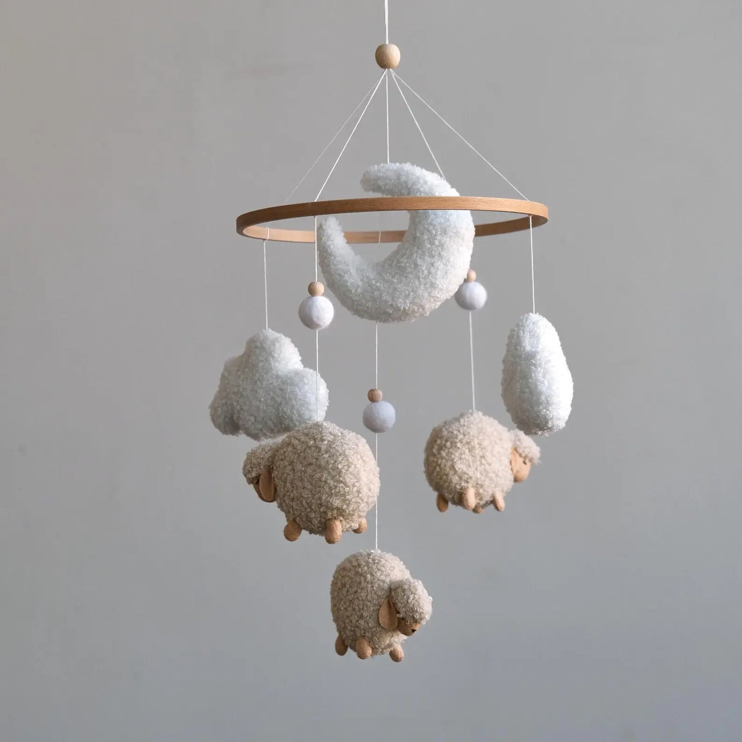 Boucle baby mobile with beige sheep moon and clouds on natural wooden ring