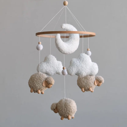 Soft baby mobile with three beige boucle sheep two clouds and crescent moon