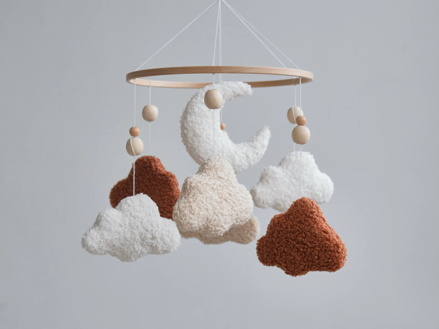 Boucle baby mobile with moon and clouds in terracotta cream and warm beige on wooden ring