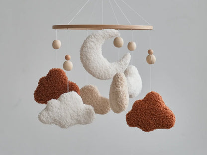 Handmade boucle cloud and moon crib mobile in terracotta and white with natural wooden beads