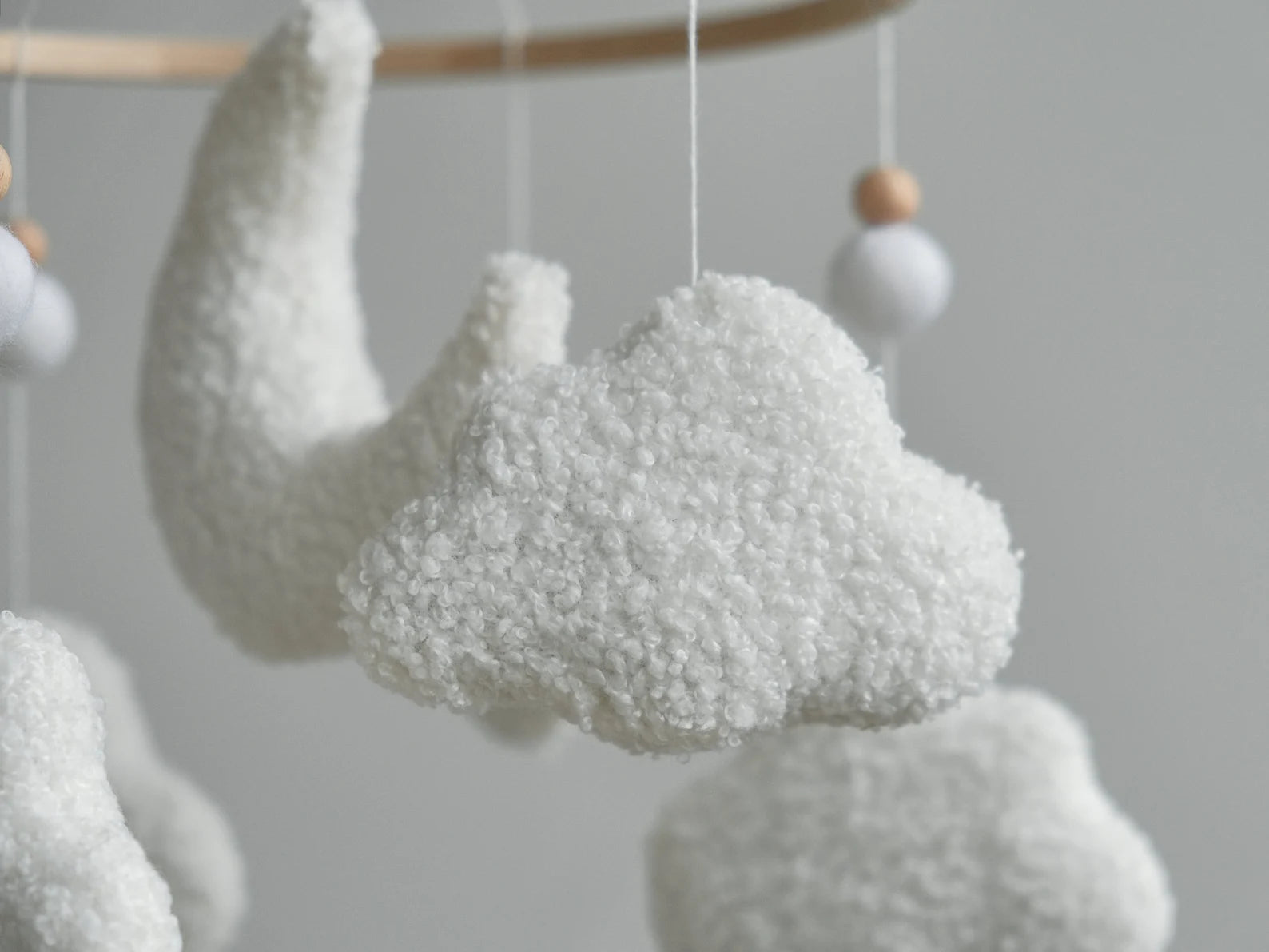Boucle cloud close-up on soft baby mobile – handmade textured plush cloud nursery mobile detail