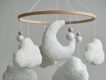 Boucle moon and clouds mobile close-up – soft textured plush crescent moon crib mobile detail
